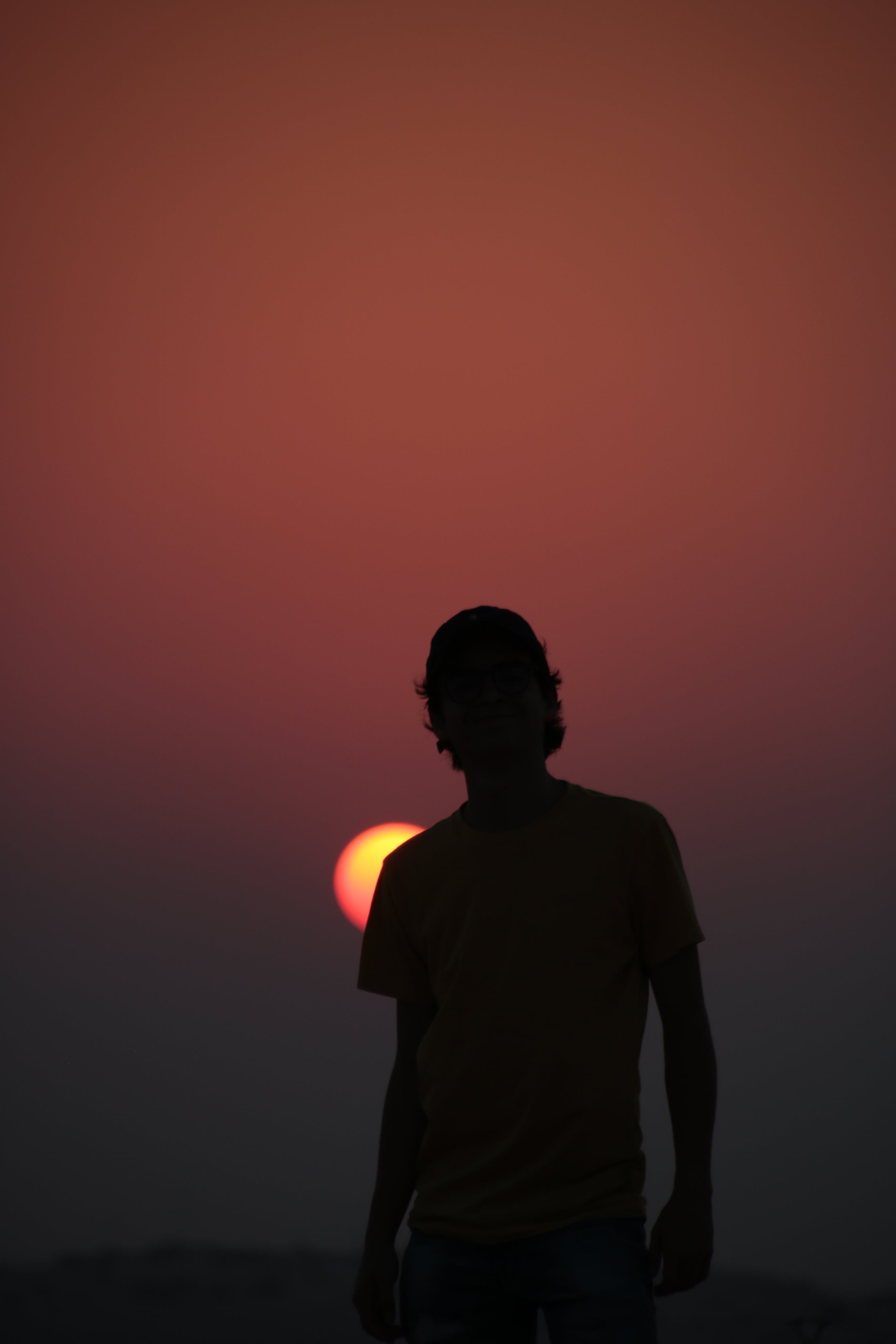 files/silhouette-of-a-person-with-a-baseball-cap-against-a-setting-sun.jpg